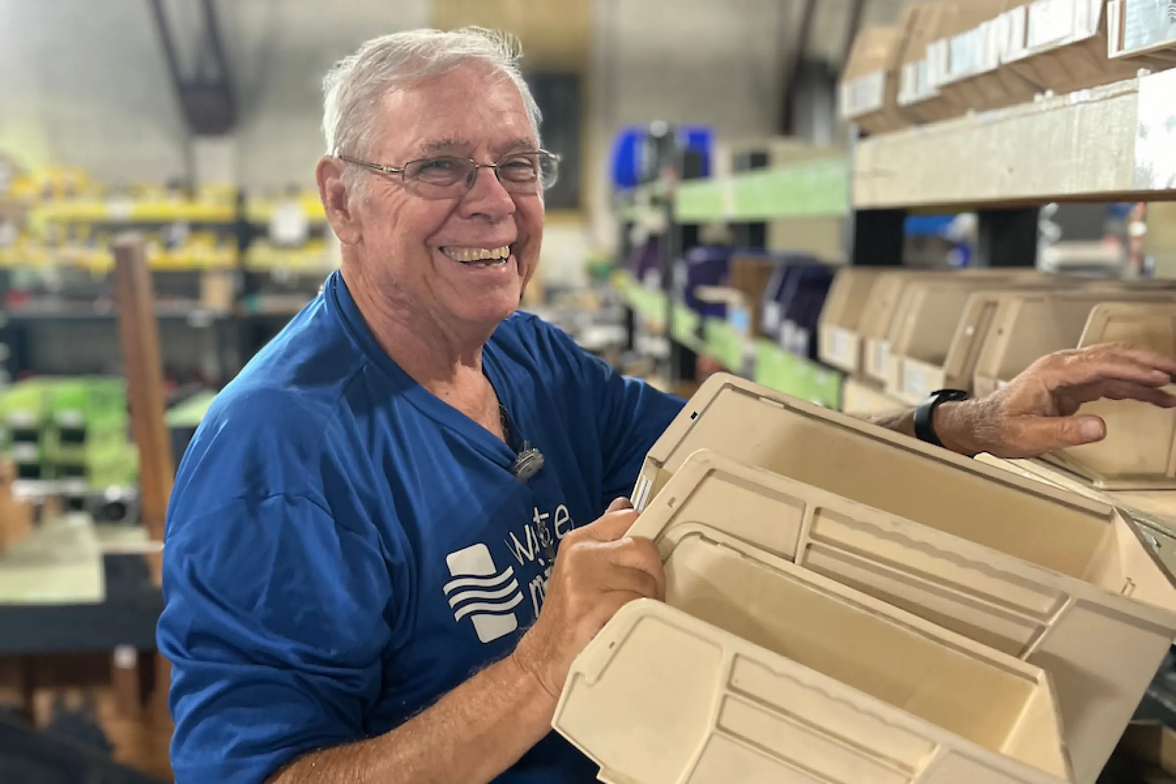A male volunteer in the warehouse