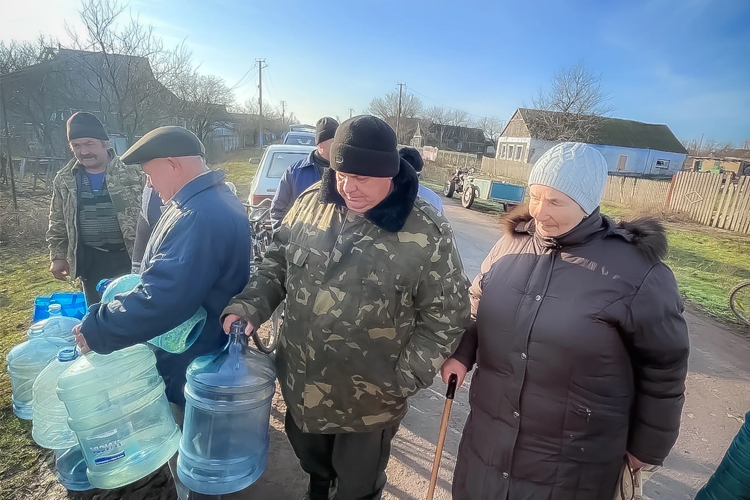 People in Ukraine filling water jubs