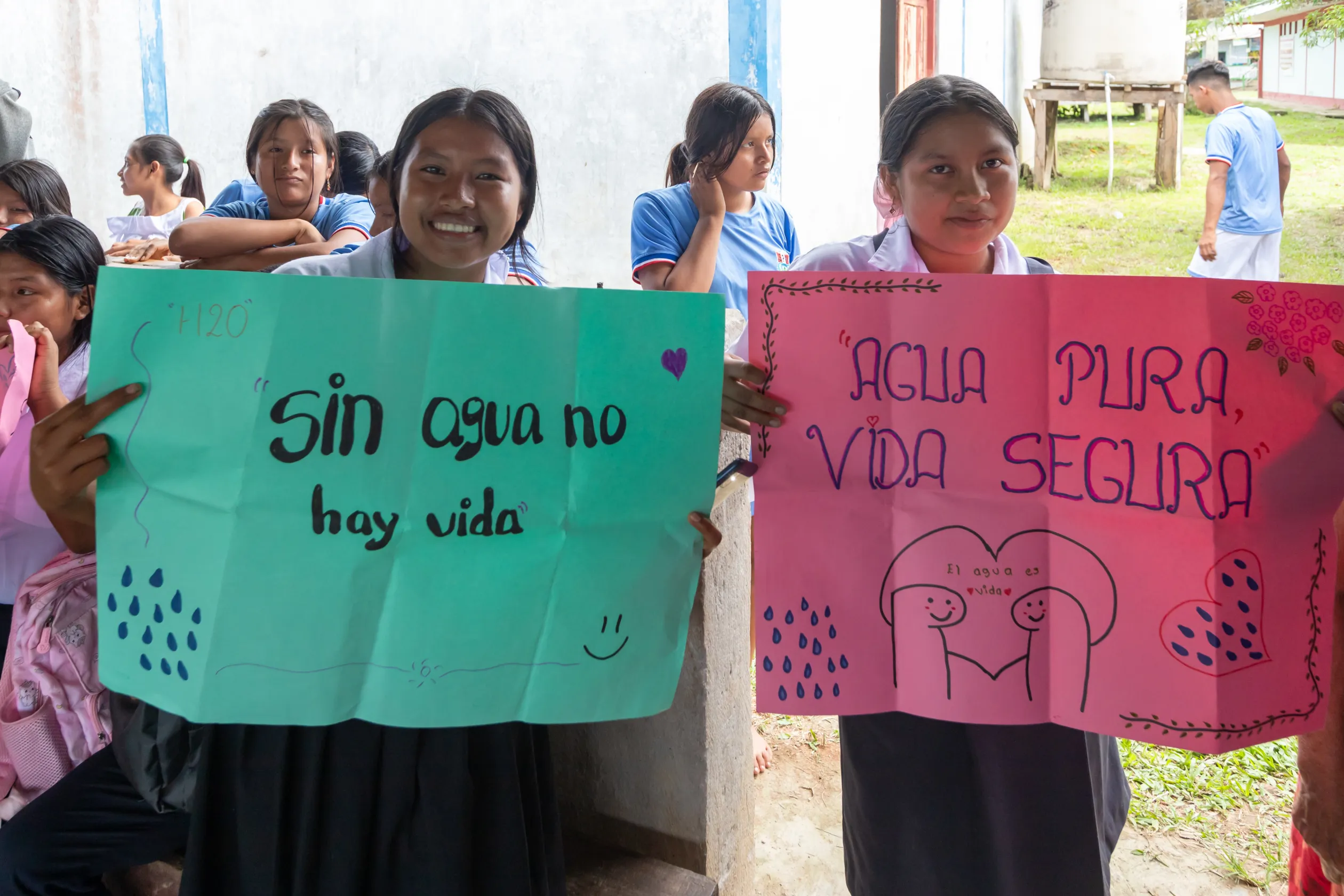 Children holding signs at celebration