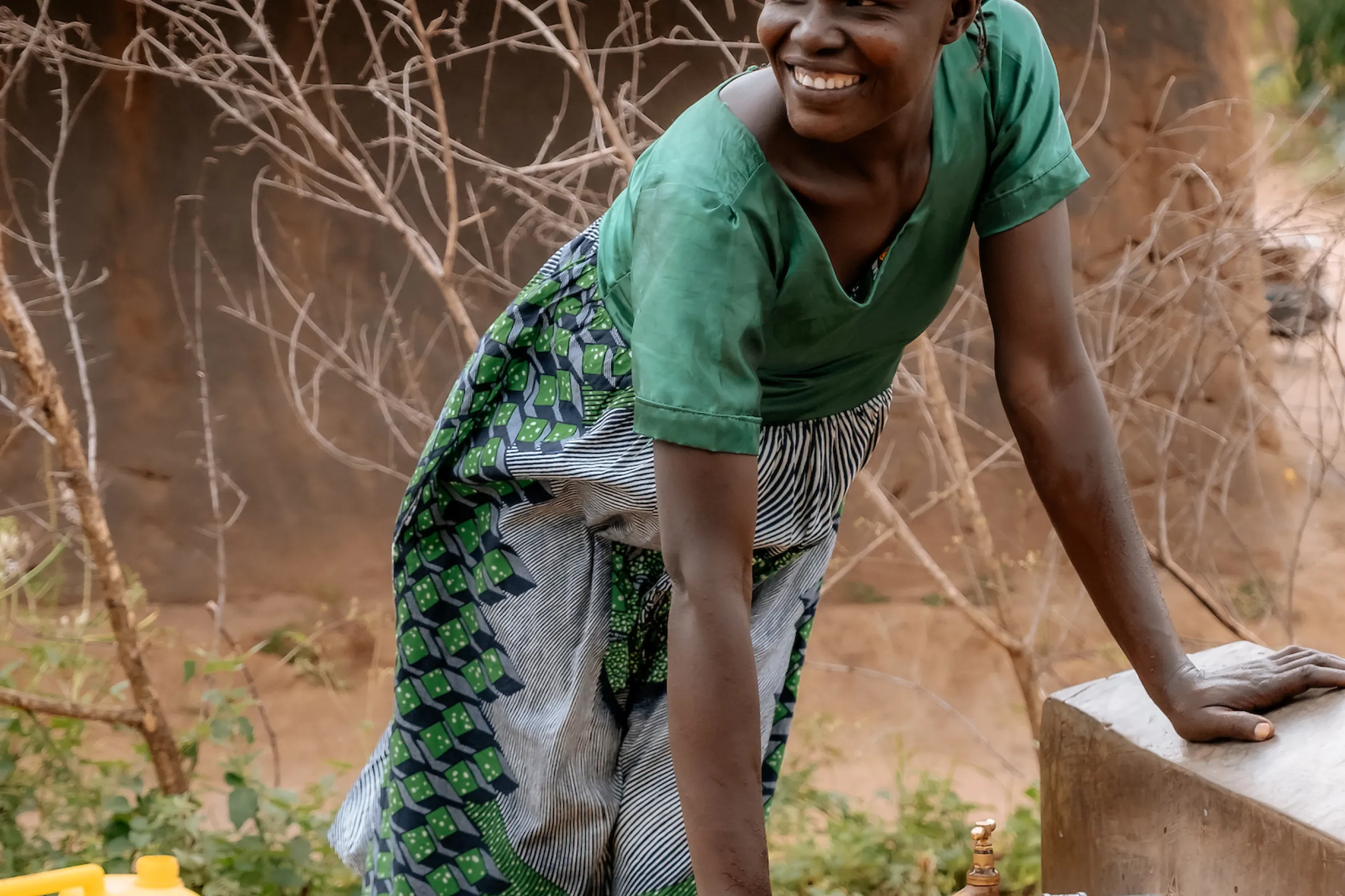 Woman collecting safe, clean water