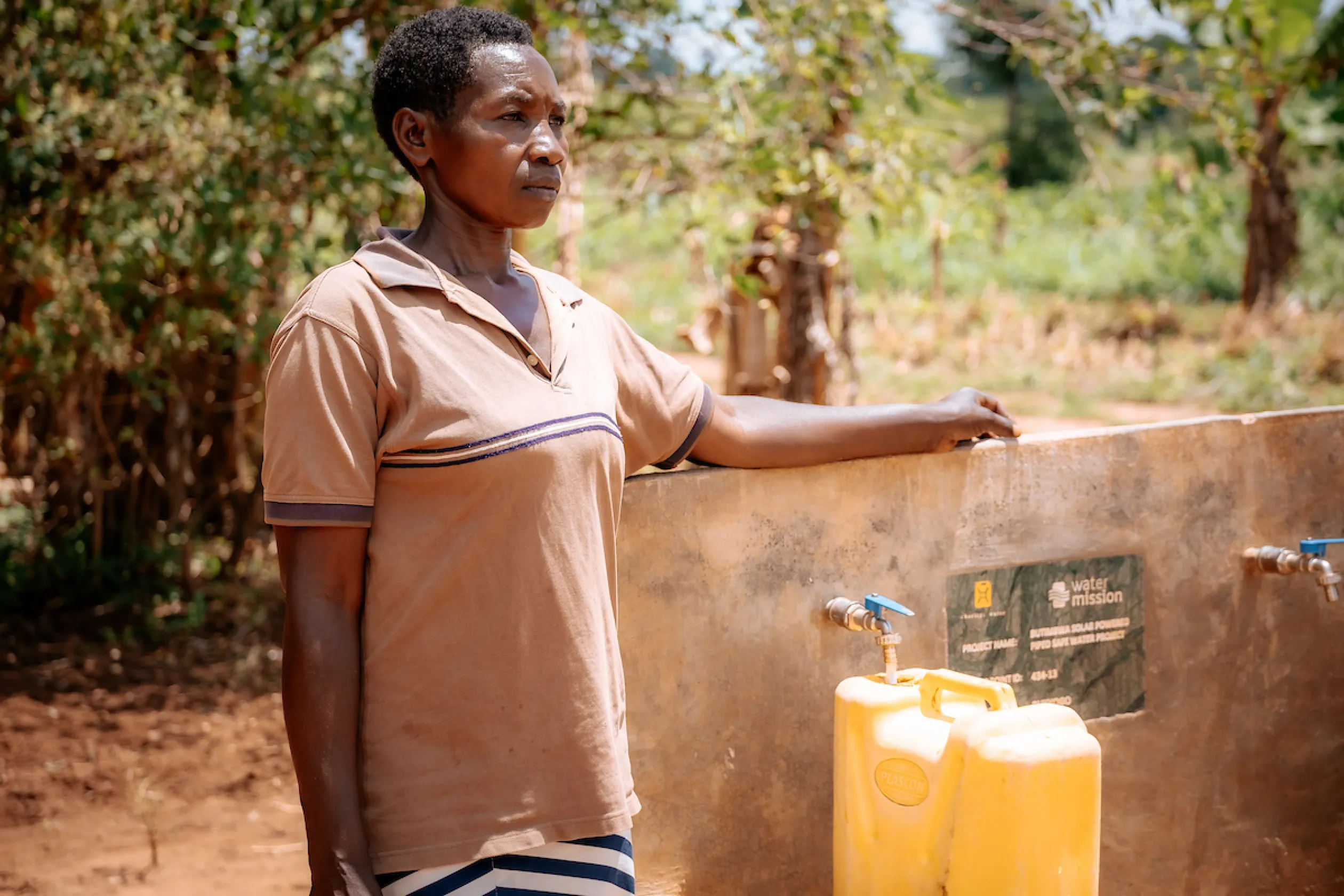Betty, a woman in Uganda, whose husband passed away from a waterborne illness