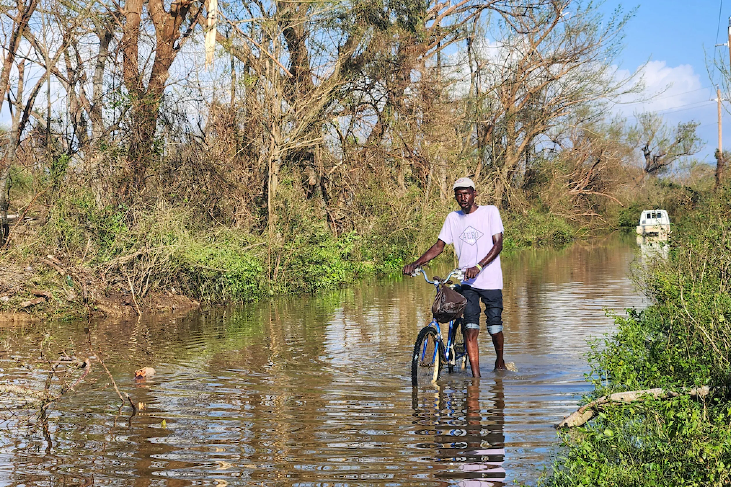 A man walks through floodwaters following Hurricane Jamaica