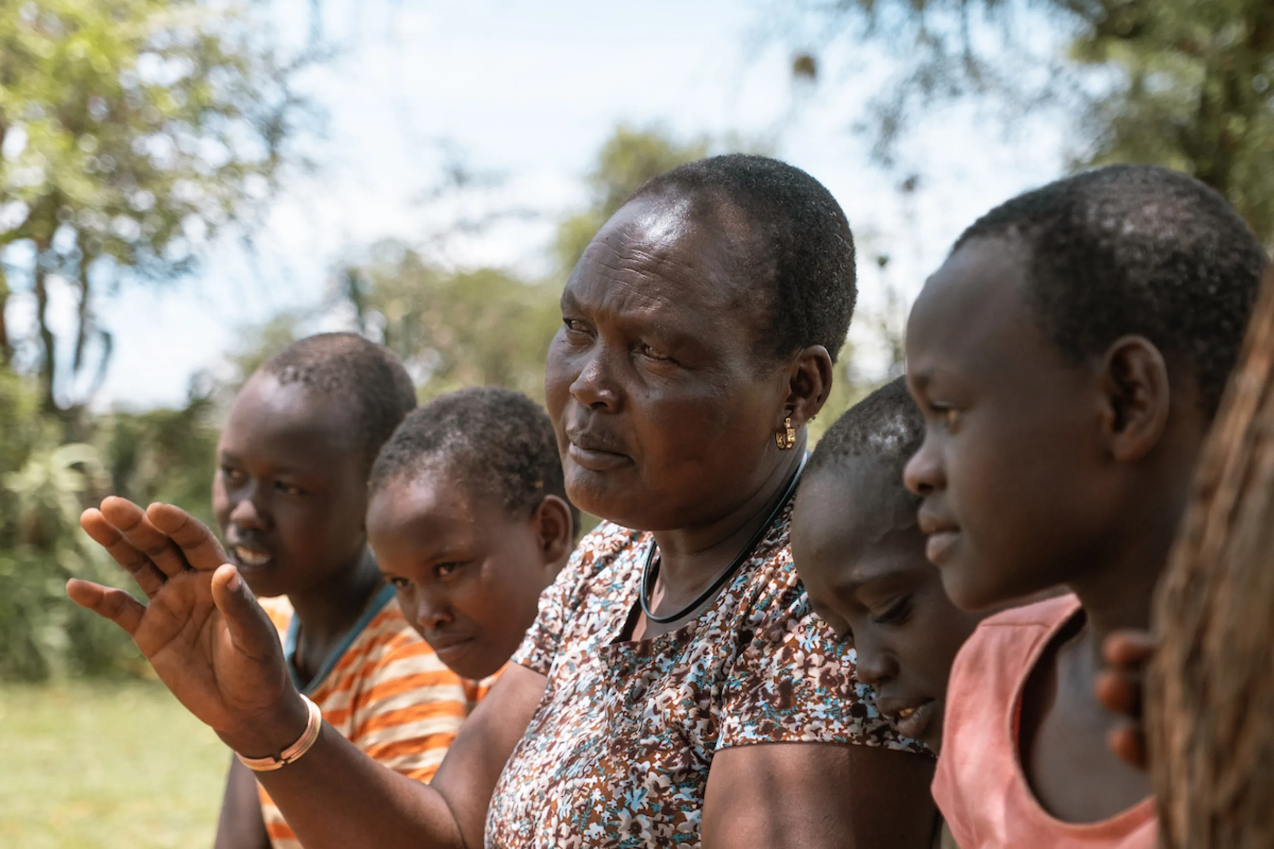 African woman talks to her grandchildren.