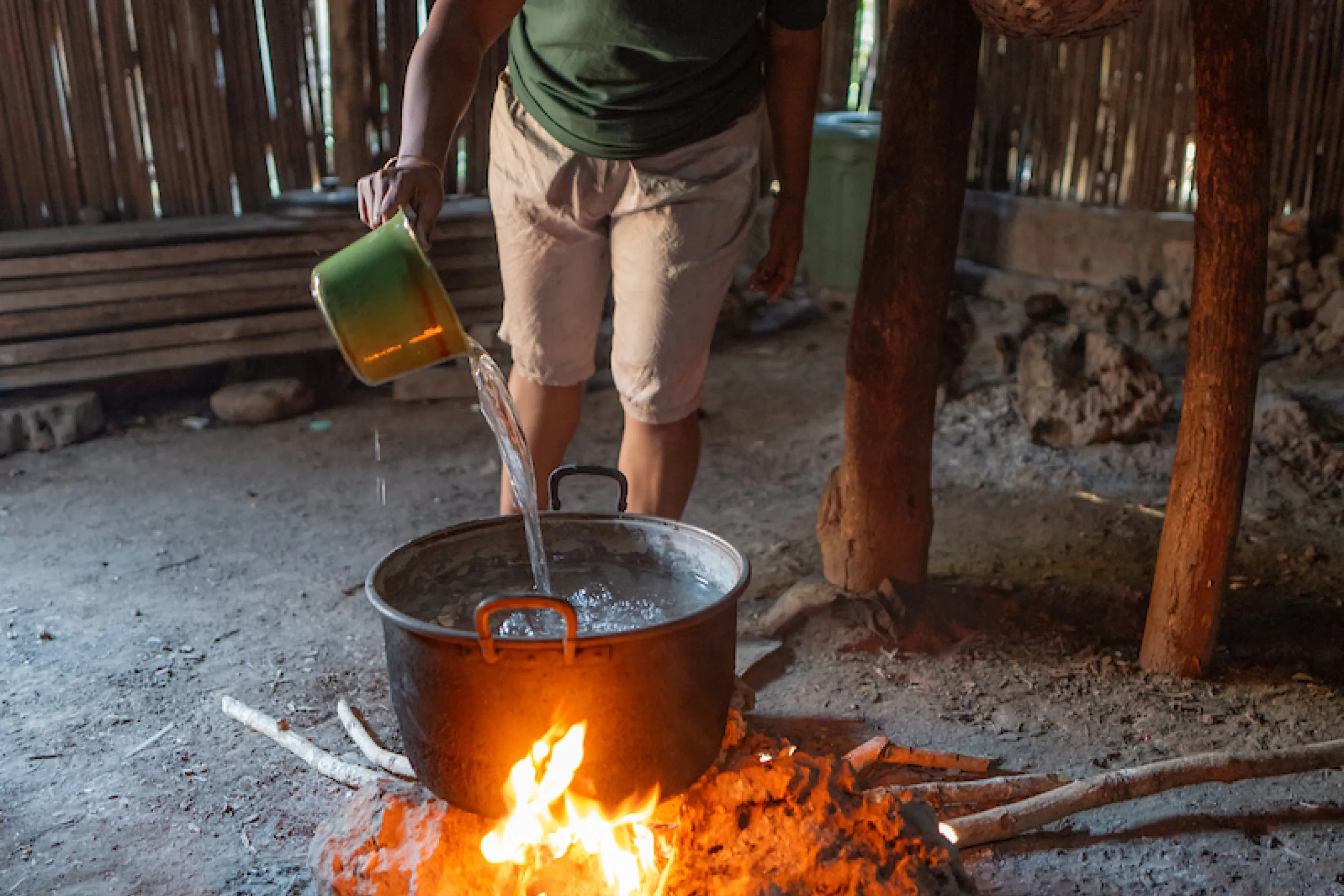 Delti cooking over an open flame