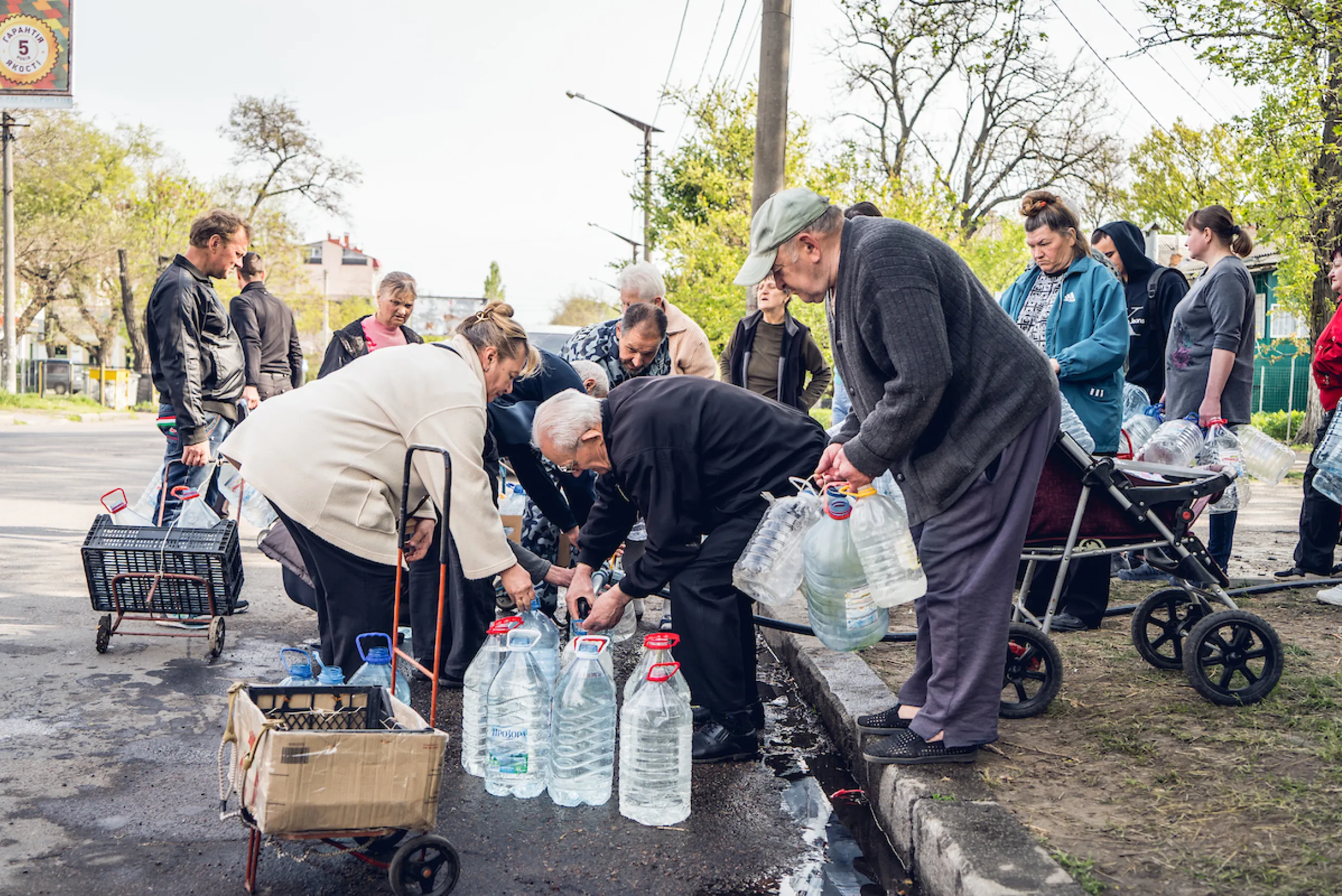 A group of people collect water