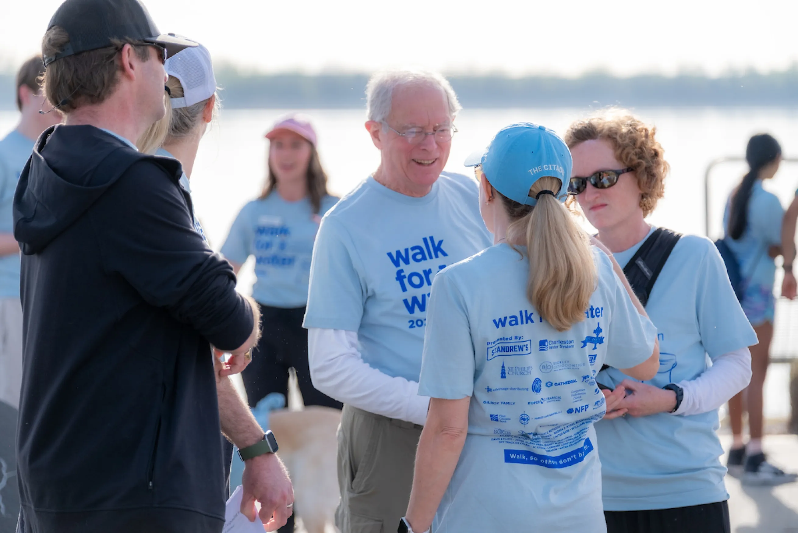 George Greene III shakes hands with walker