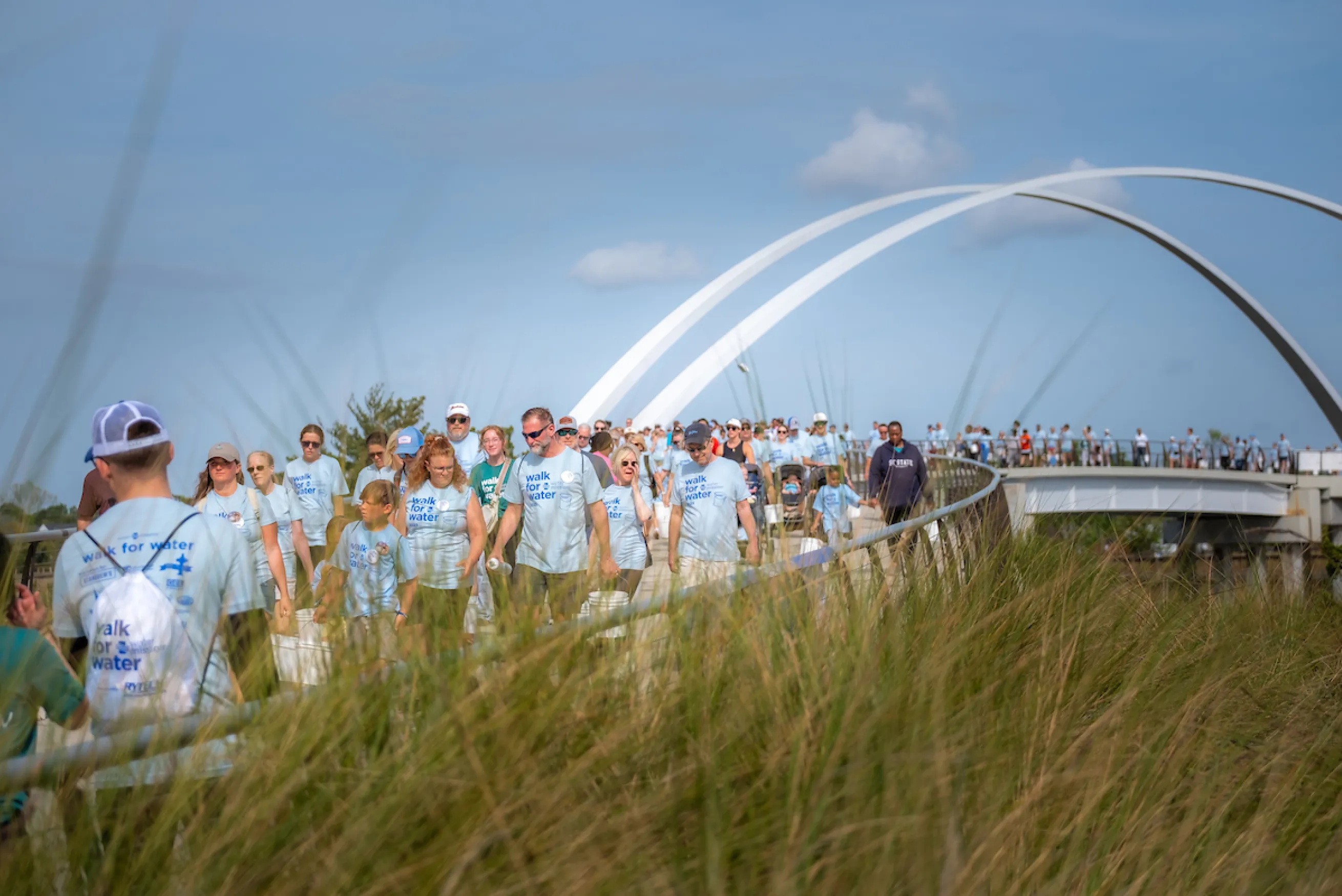 Walkers cross bridge