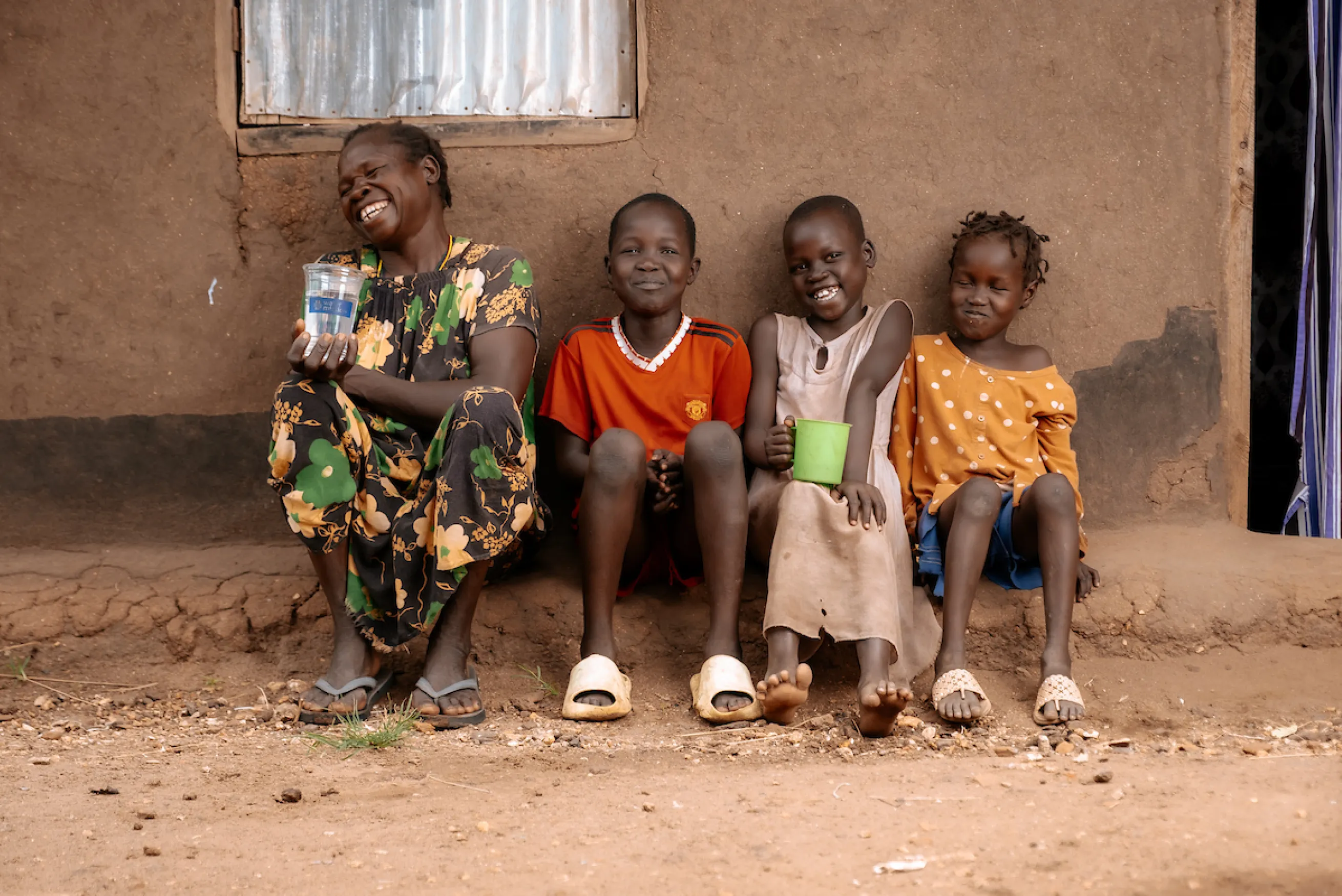 Family with safe water and smiling