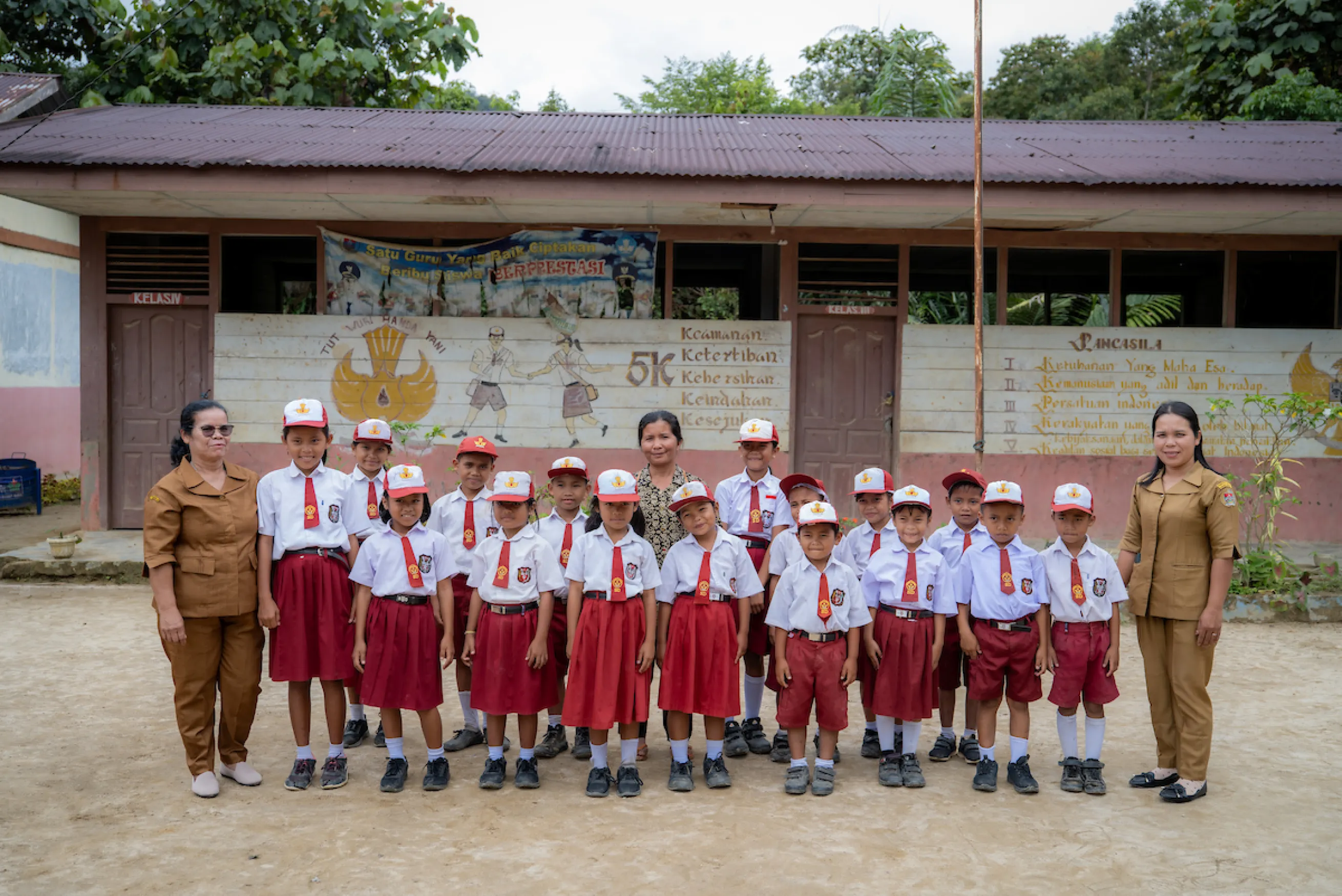 Schoolchildren pose for a photo