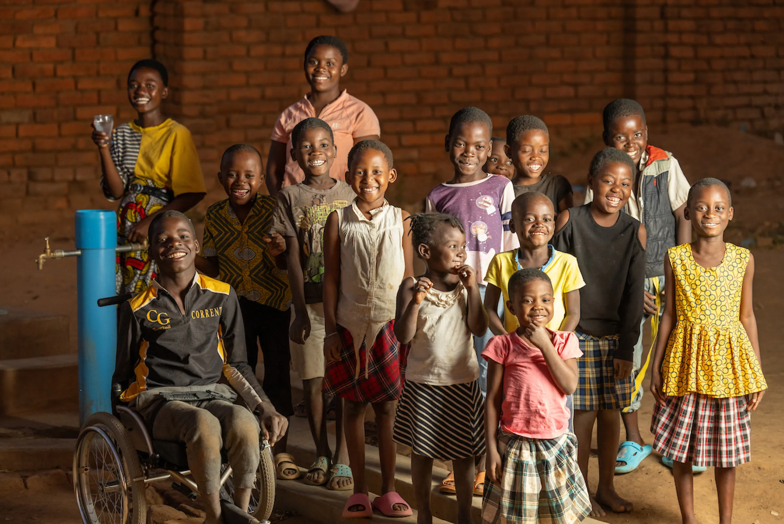 Children gather near a Water Mission tapstand in Golomoti, Malawi