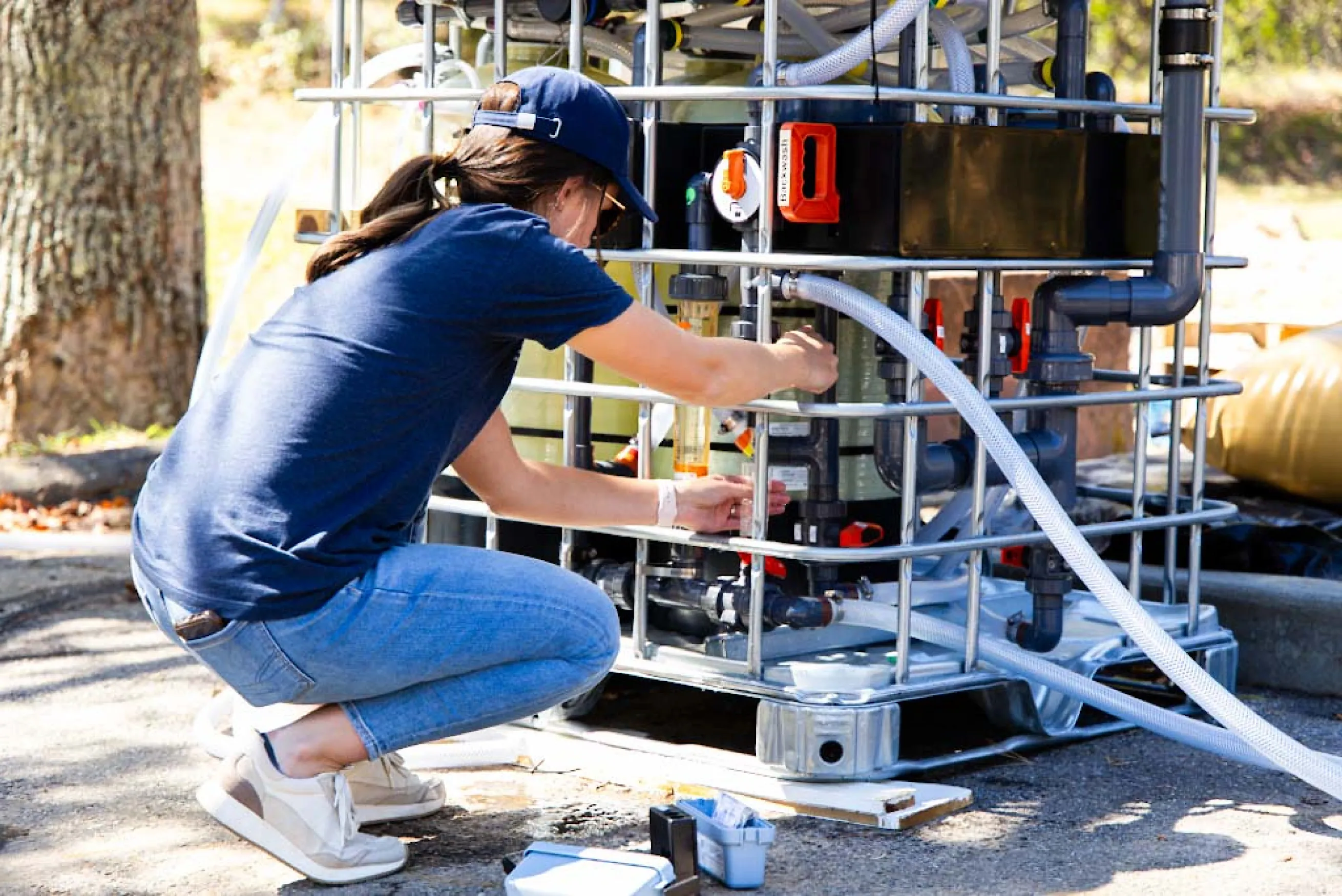 Water Mission team member works on a Living Water Treatment System