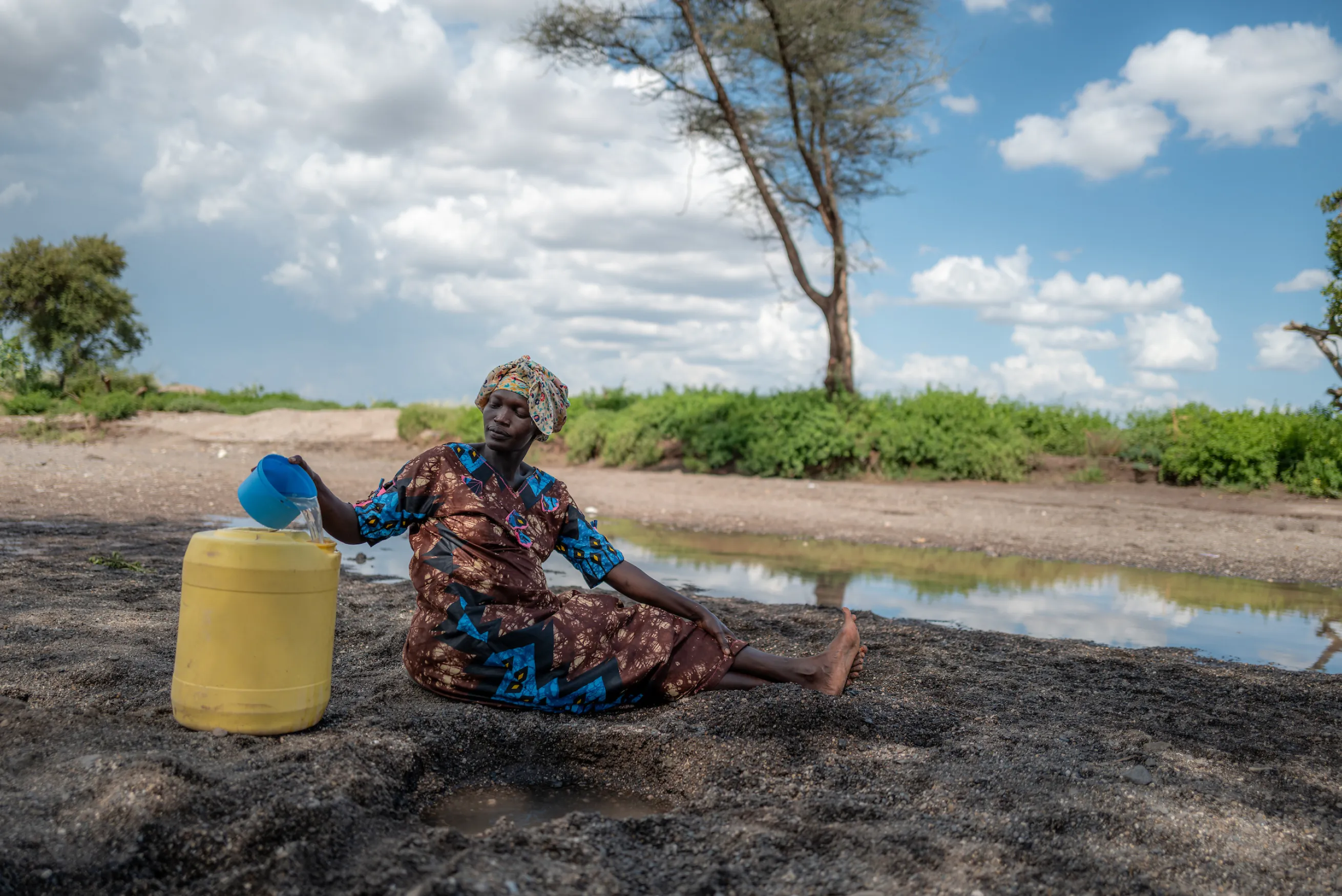Woman filling jerry can in Turkana Kenya