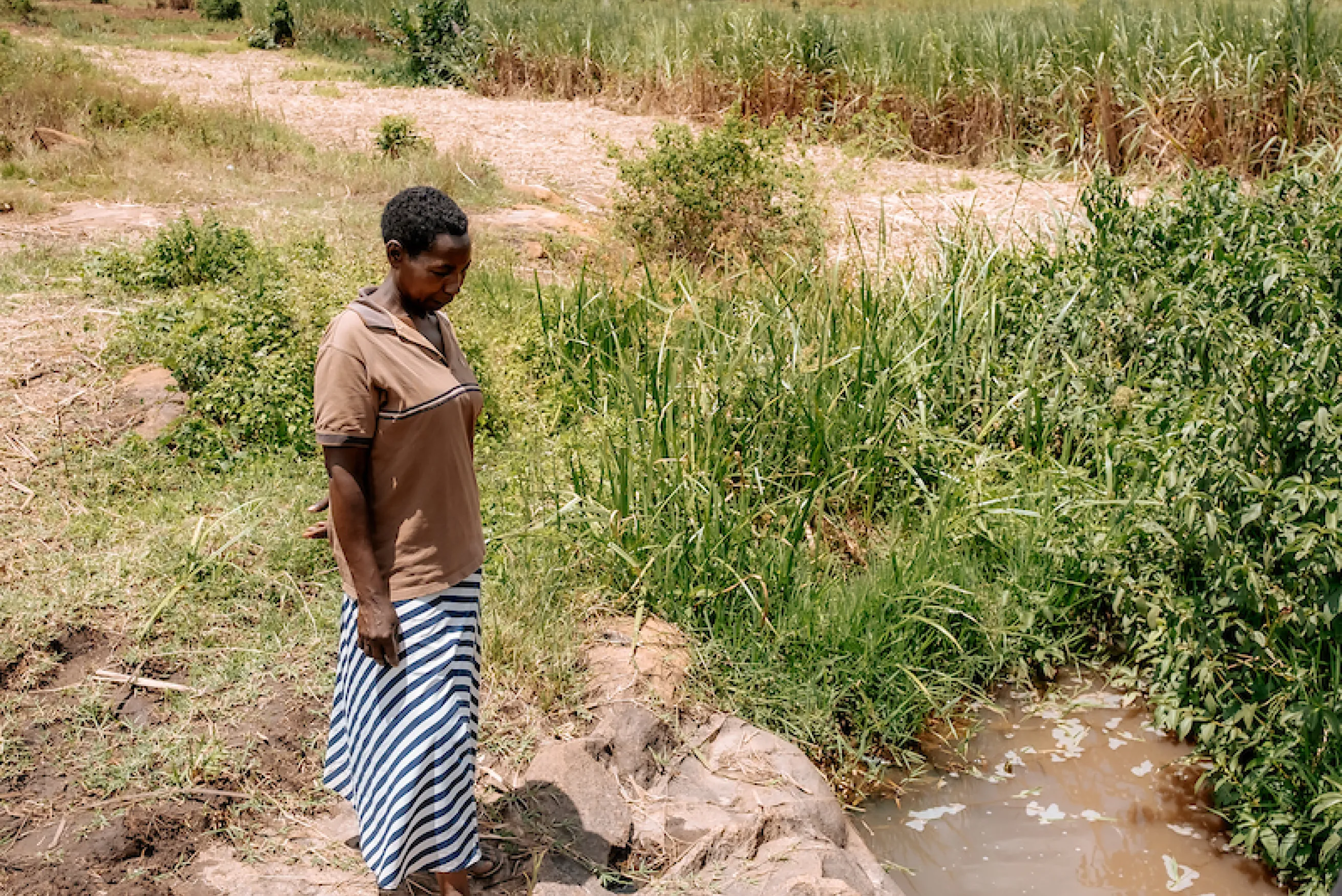 Betty, a woman in Uganda, whose husband passed away from a waterborne illness