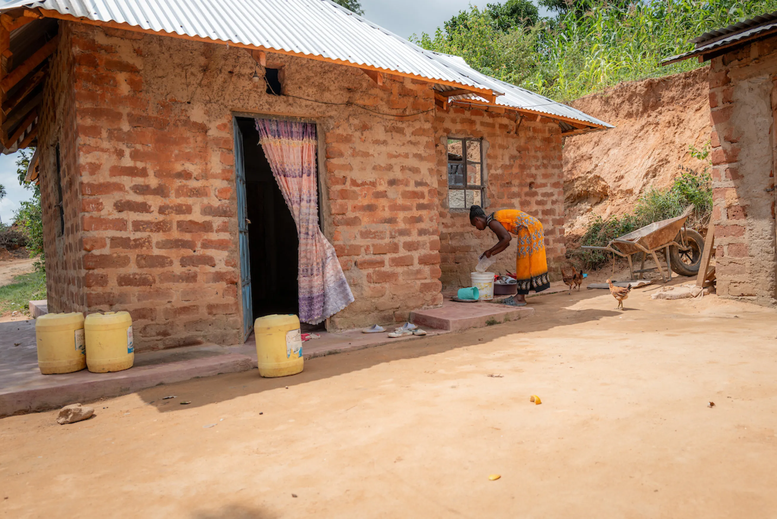 A woman doing domestic duties in Kenya, Africa