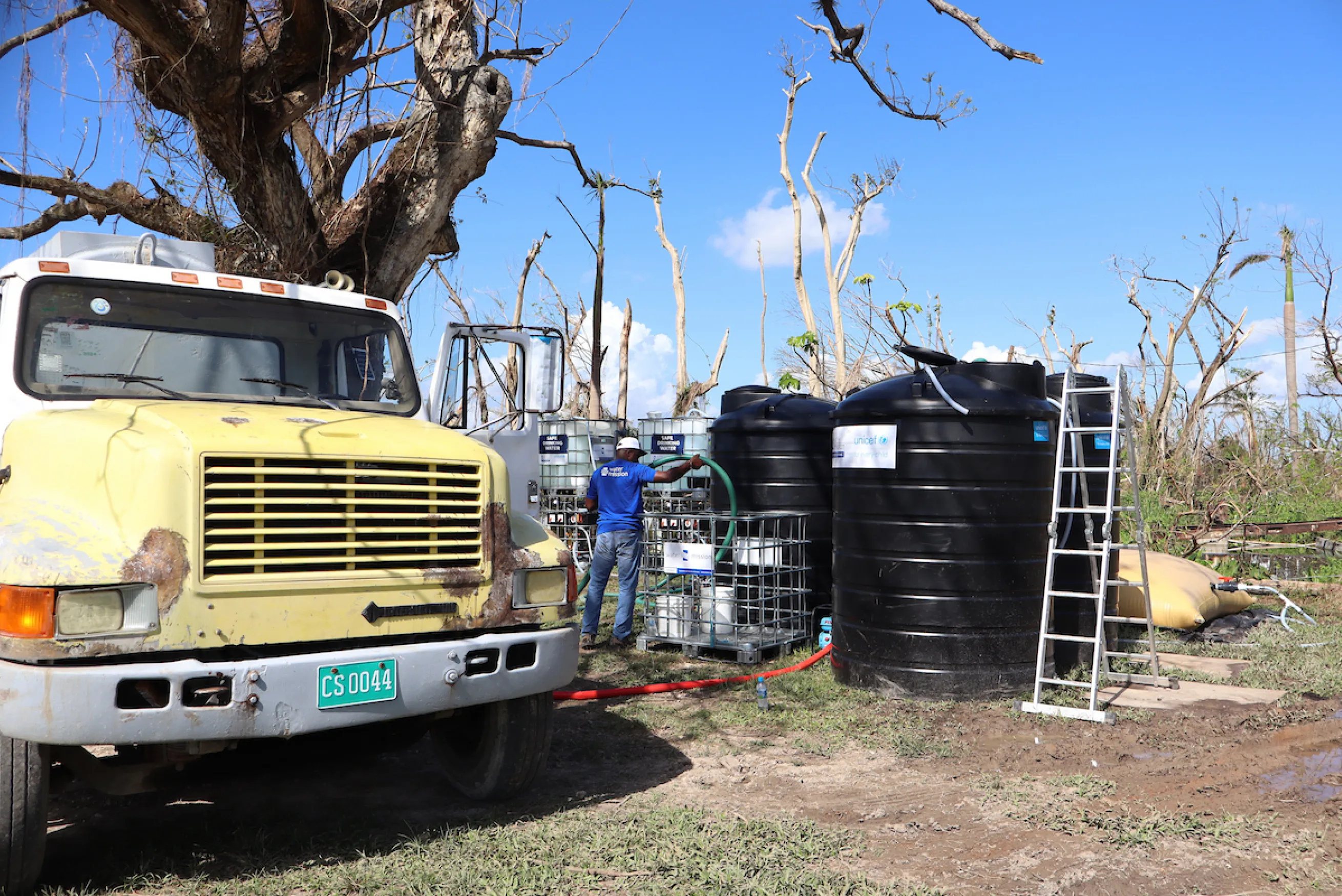 Water Mission DART members installs a safe water system