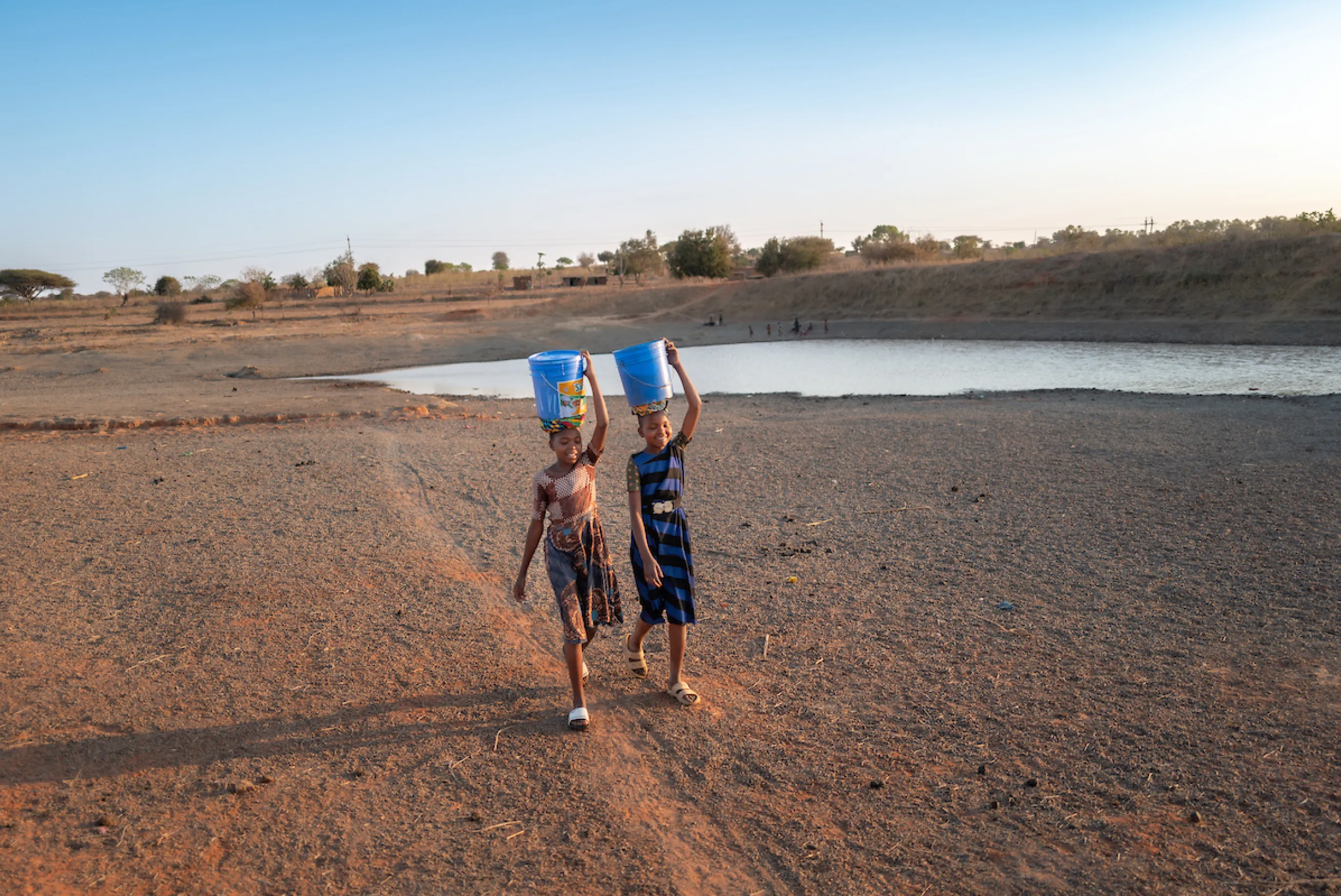 Neema and Recho walk for water in Tanzania, Africa