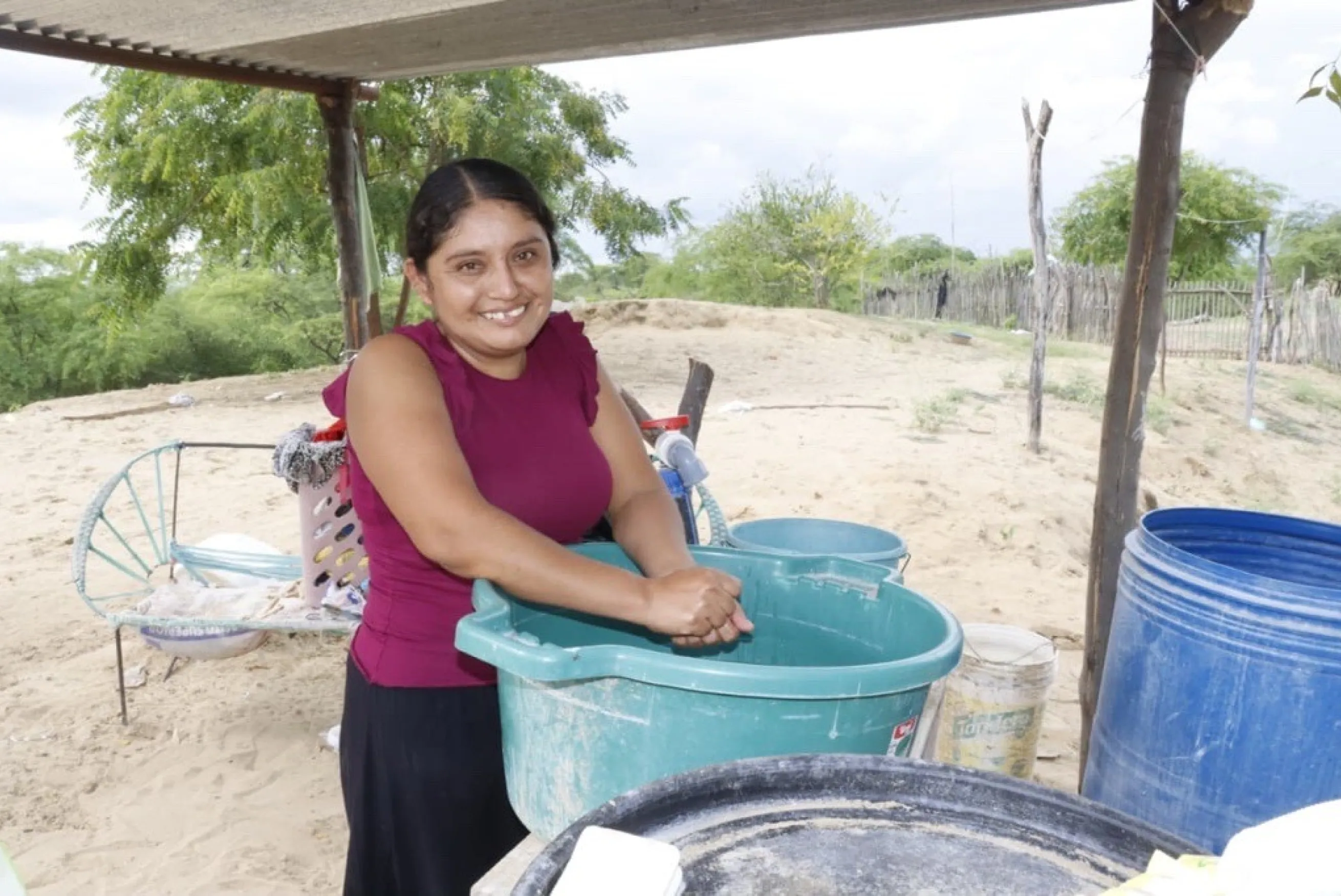 Mother washing hands in Peru