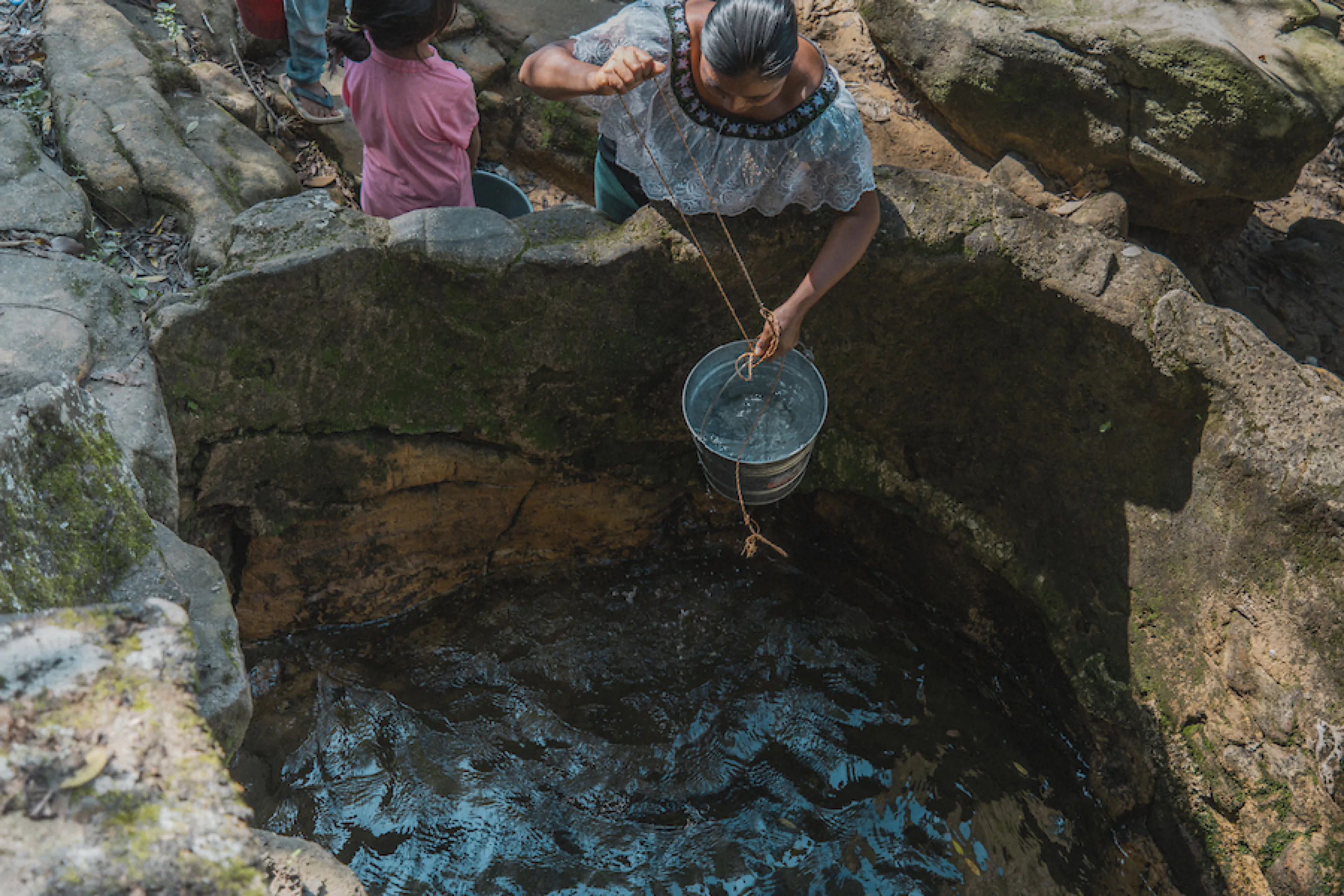 Maria and her children fetch water in Mexico