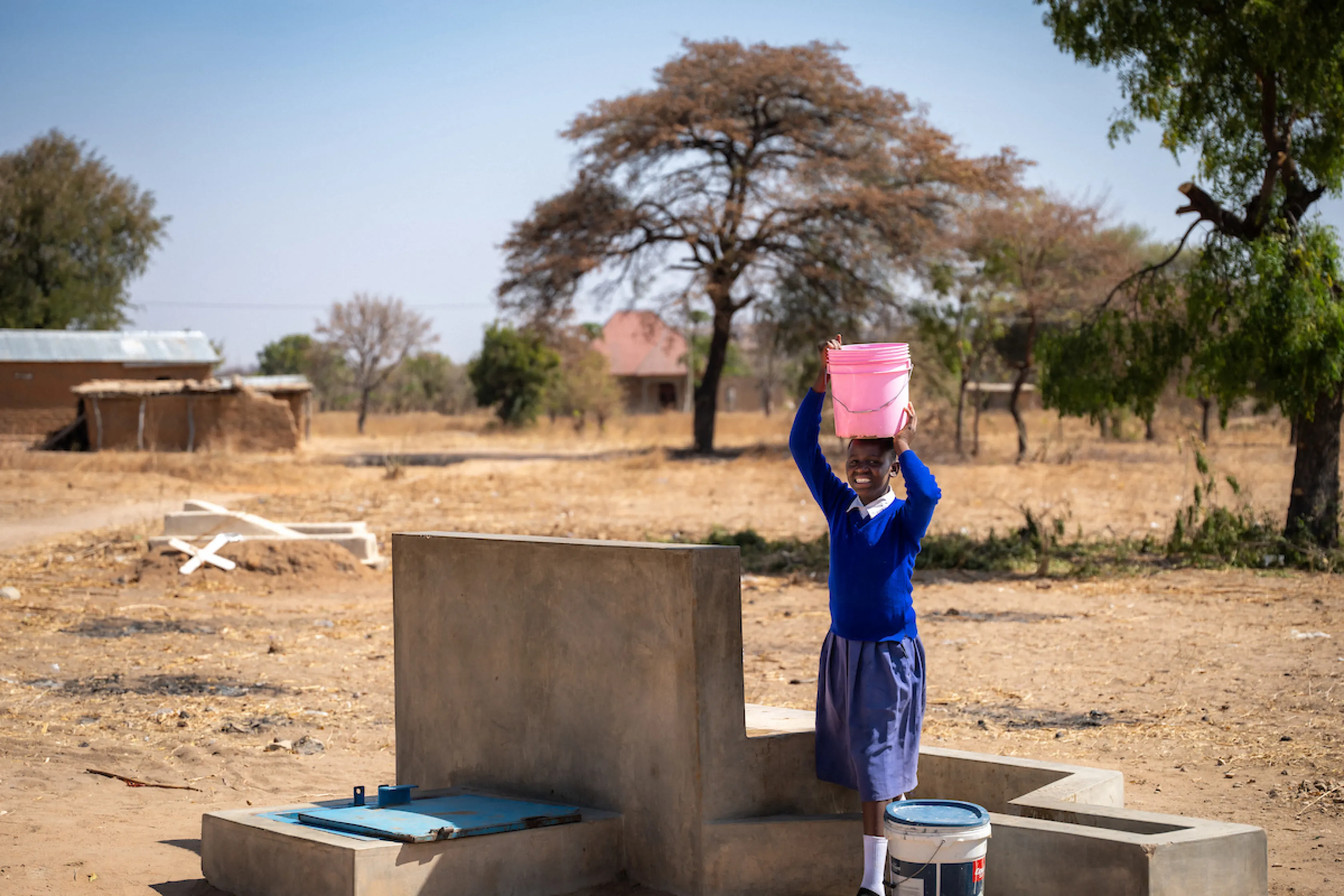 Young girl in Tanzania accesses safe water