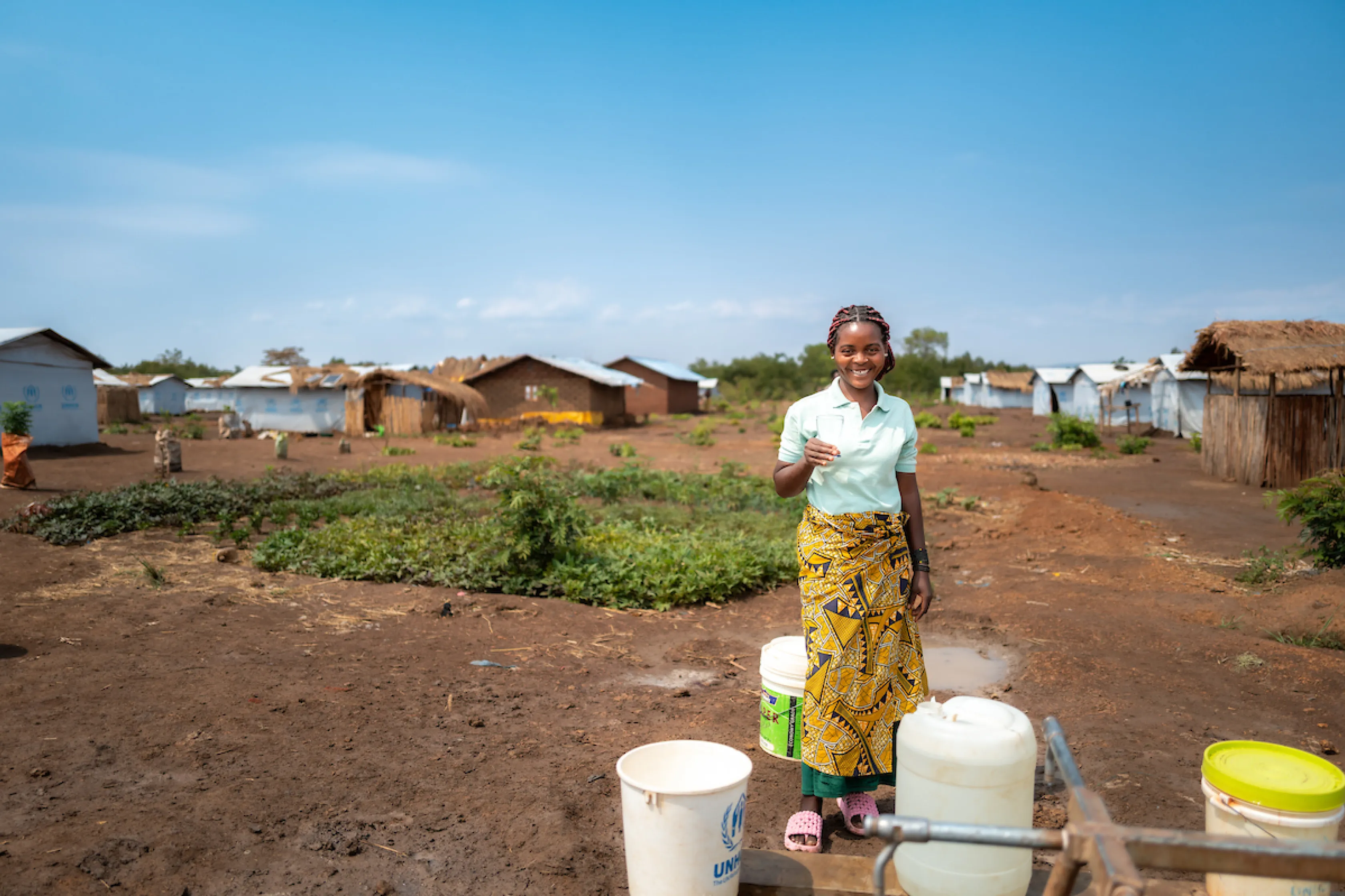 Katembo with safe water; Nyarugusu refugee camp; Tanzania, Africa