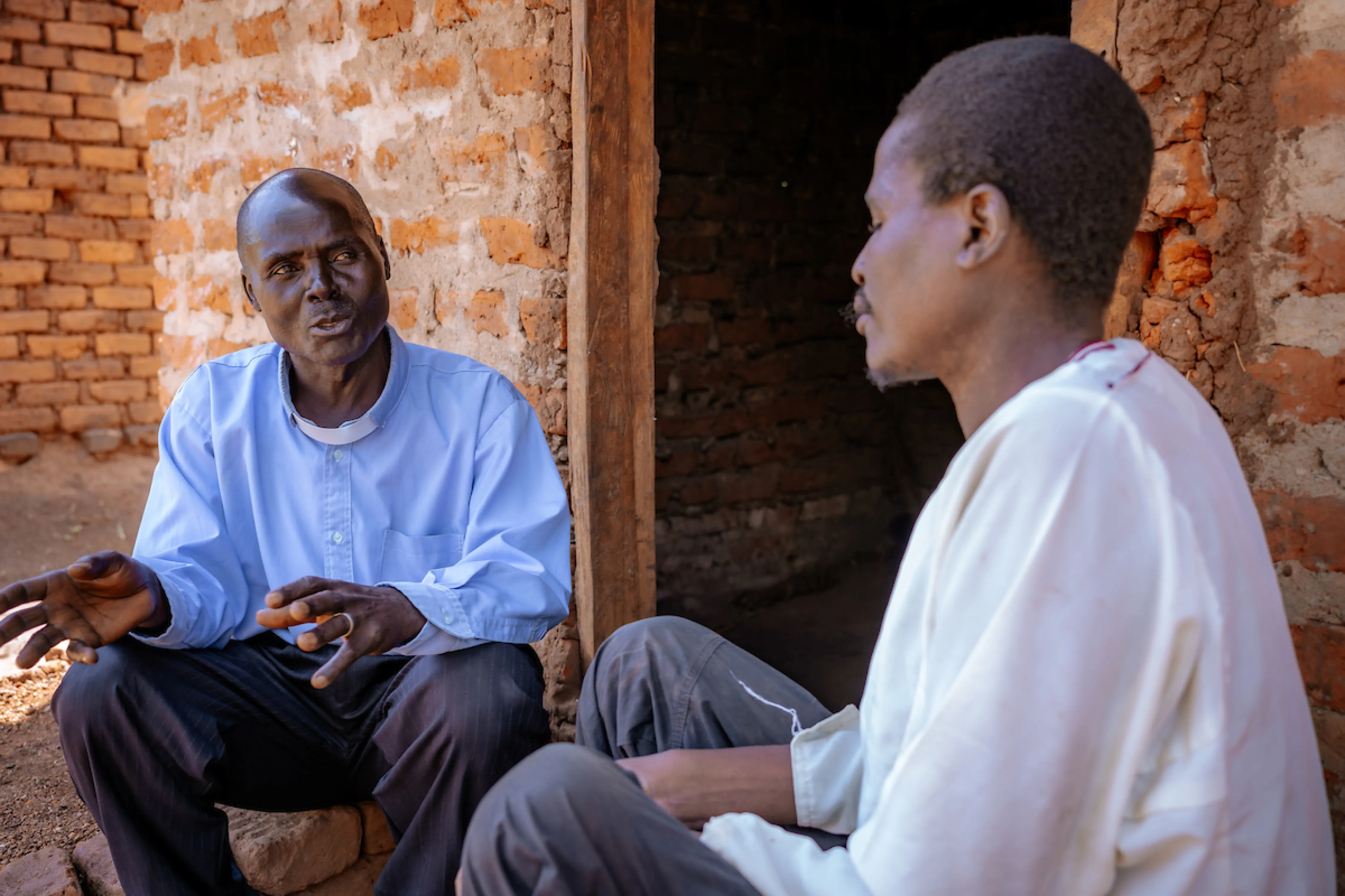 Pastor Laston speaks with a man