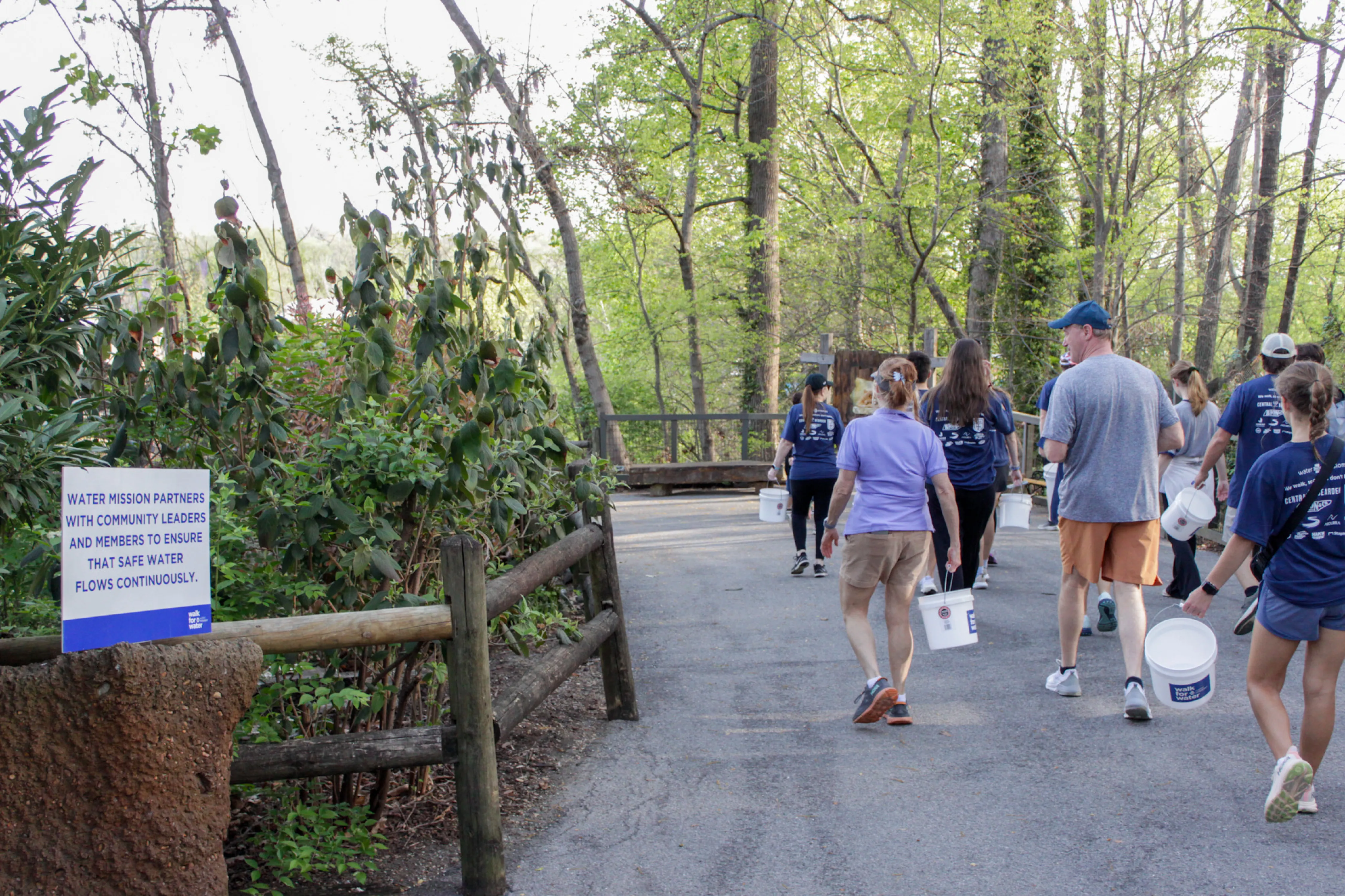 Walkers carrying buckets