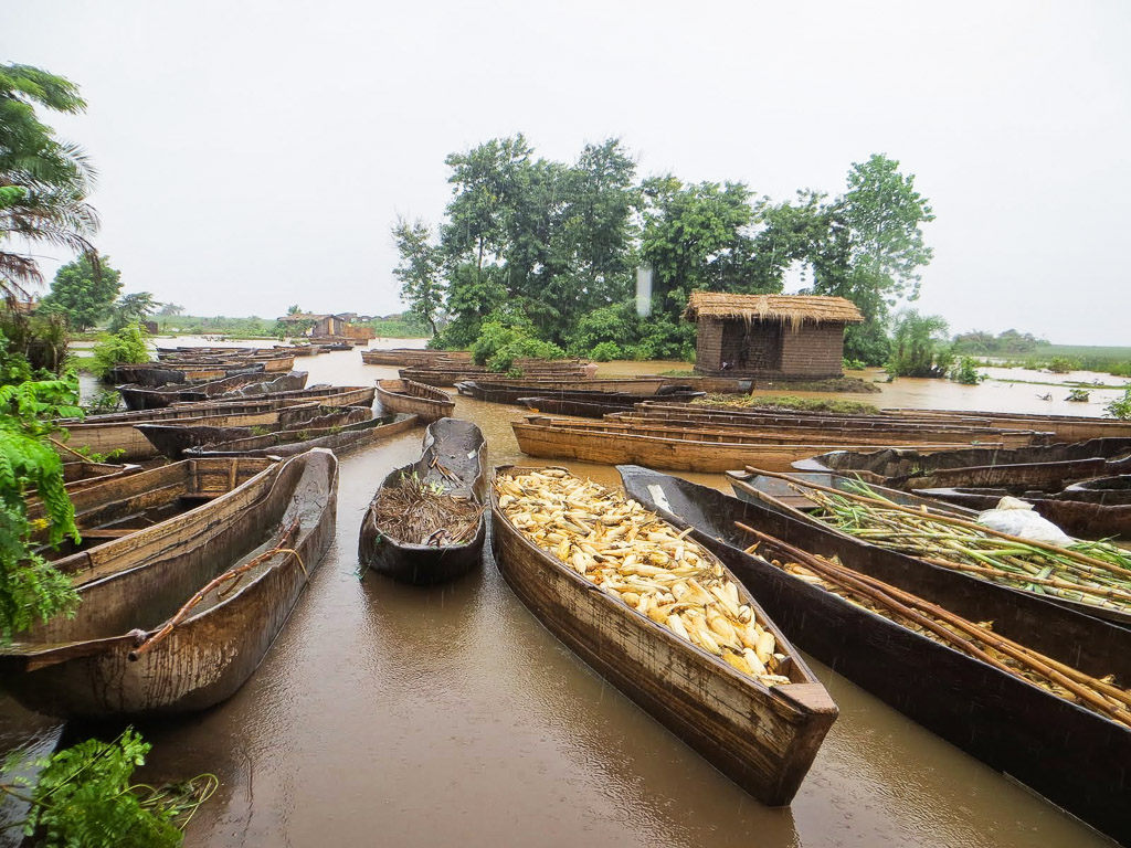 Survivors transport salvaged belongings and food after floods hit Malawi