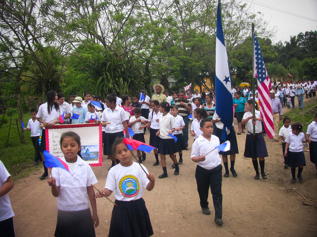 A parade welcomes Scotty Parker in Honduras, celebrating him raising money for safe water.