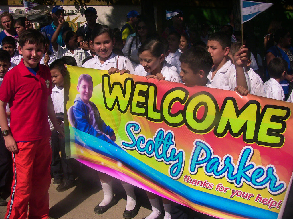 Scotty Parker is welcomed by students in Honduras.