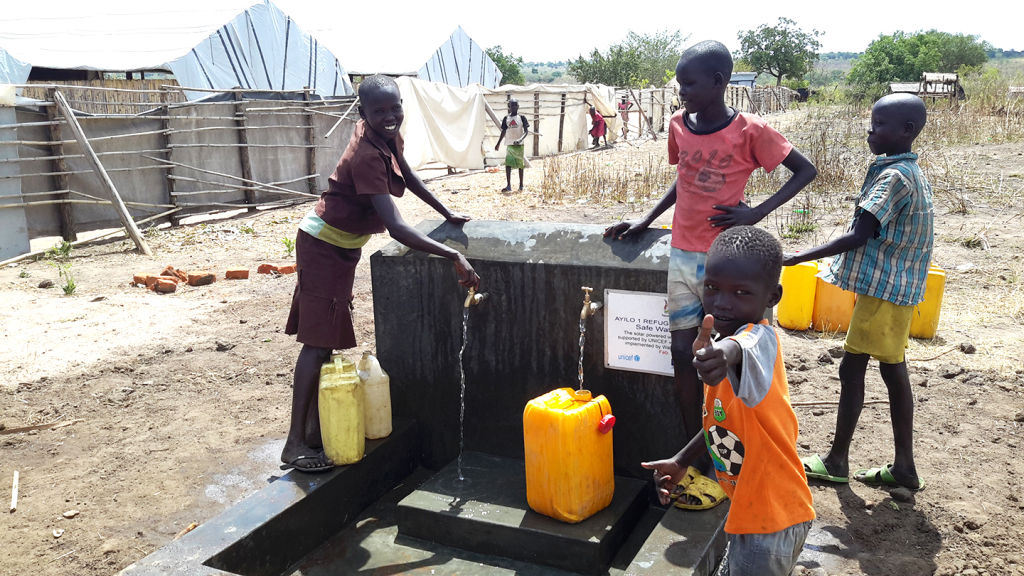 Children collect clean water in Ayilo Refugee Camp