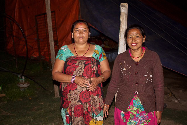 Earthquake survivors show their temporary homes.