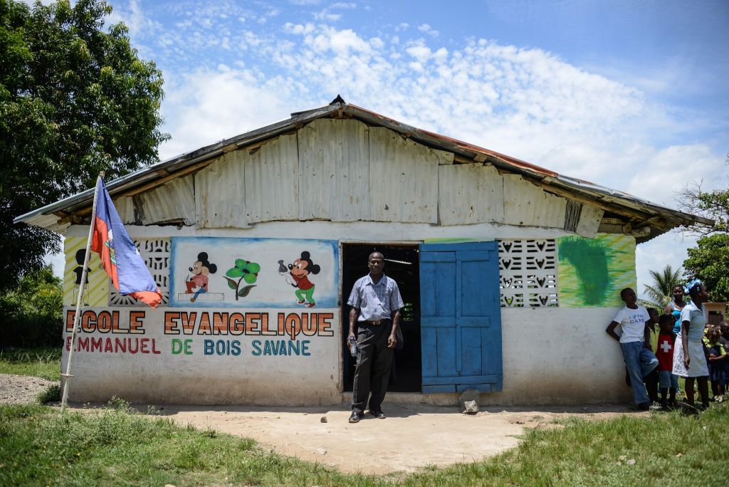 Pastor Philome stands outside his church | Bois Savanna, Haiti