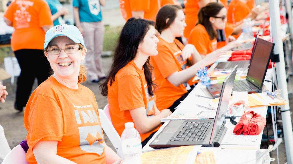 Volunteers at registration tables at 10th Annual Charleston Walk for Water