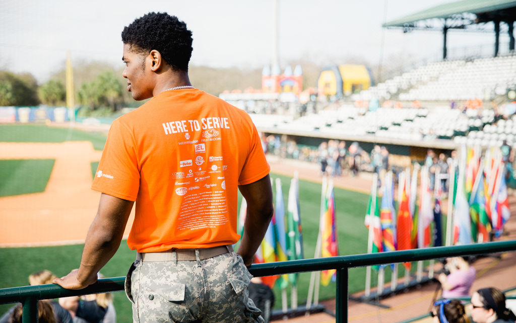 Volunteer looks out over stadium before walkers arrive.
