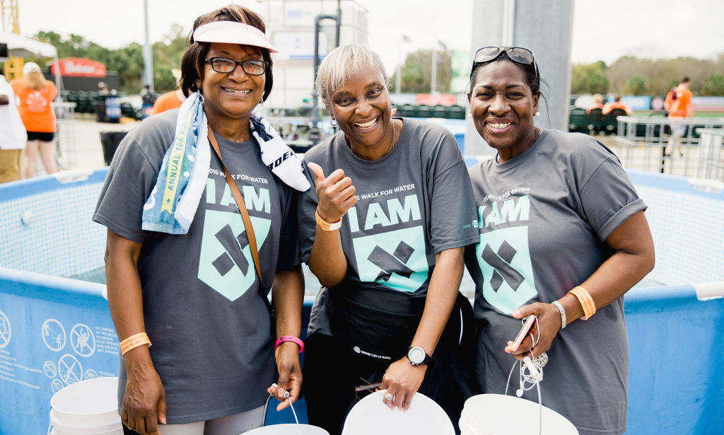 Walkers give thumbs up at end of the Charleston Walk for Water