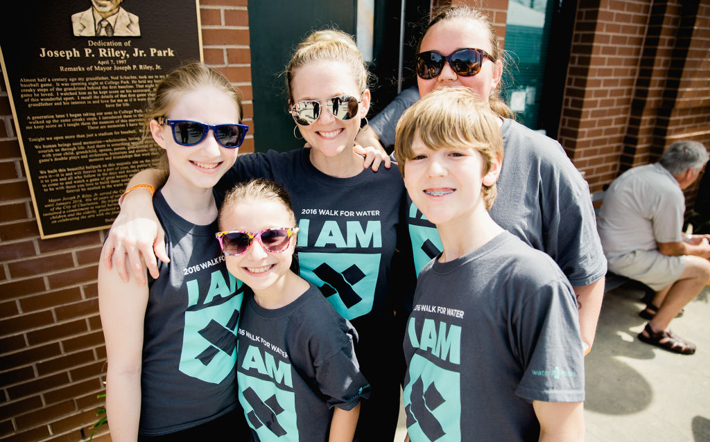Walkers smile together at the 10th Annual Charleston Walk for Water at Joseph P. Riley, Jr. Stadium