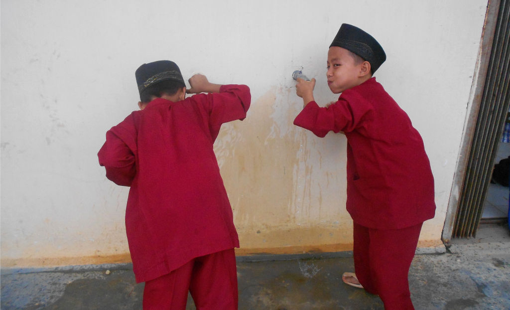 Kids drinking safe water in Kulim, Indonesia