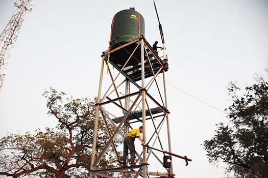 The team assembles the safe water tower.