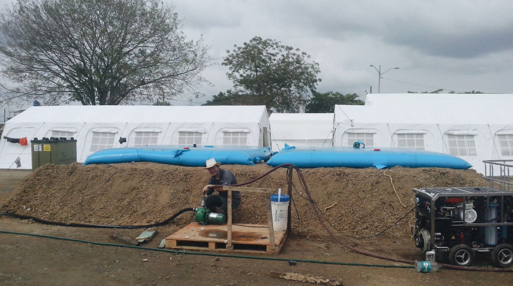 Water Mission engineer Bert Morrison with water equipment at Ecuador field hospital