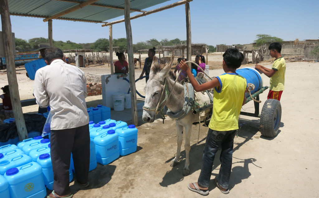 Residents in San Martin de Letira collect water