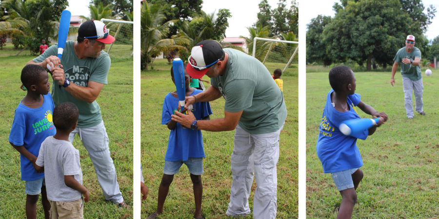 Lance Berkman, MLB All Star, teaches kids at EBAC Orphanage in Haiti how to play baseball.