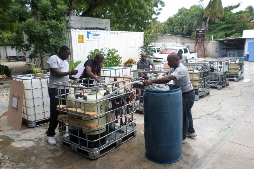 Water Mission Haiti staff prep treatment systems before moving into the field.
