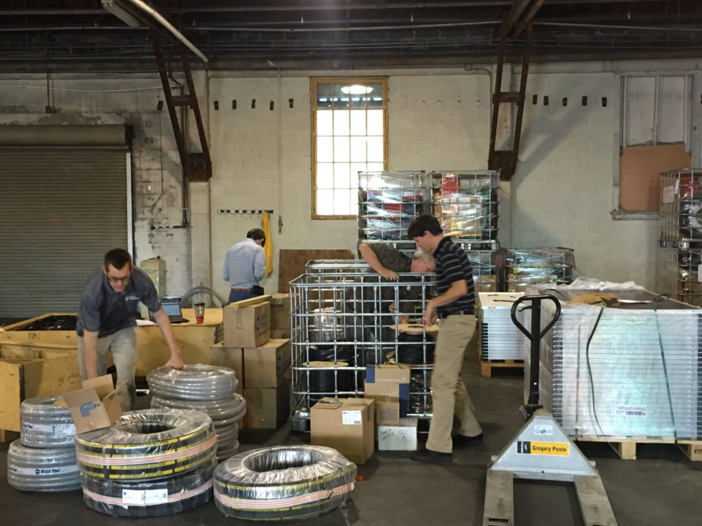 Water Mission staff organize treatment systems bound for Haiti.
