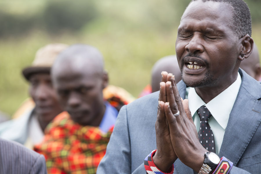 A leader in Enariboo, Kenya, prays for a solution to find safe water.