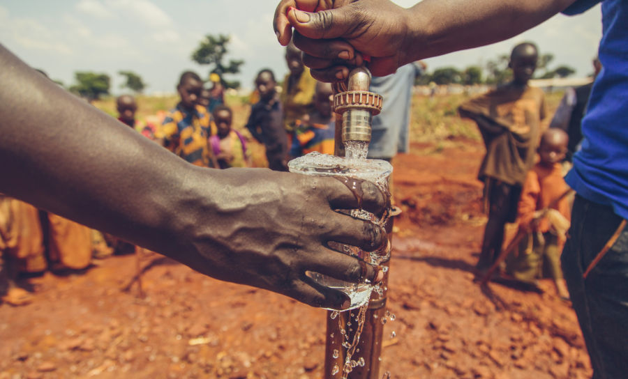 Safe water flowing from a tap in Nyarugusu Refugee Camp, Tanzania.
