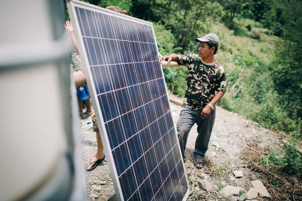 Solar panels are installed at a disaster response project in Nepal.