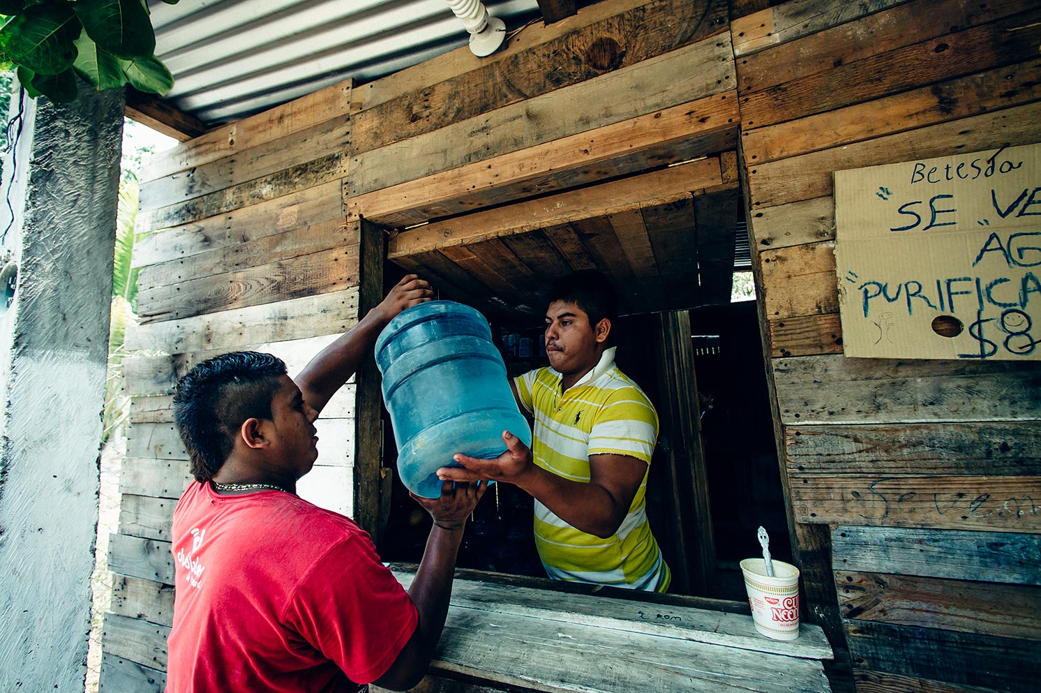 A man collects water to distribute to another community in Mexico.