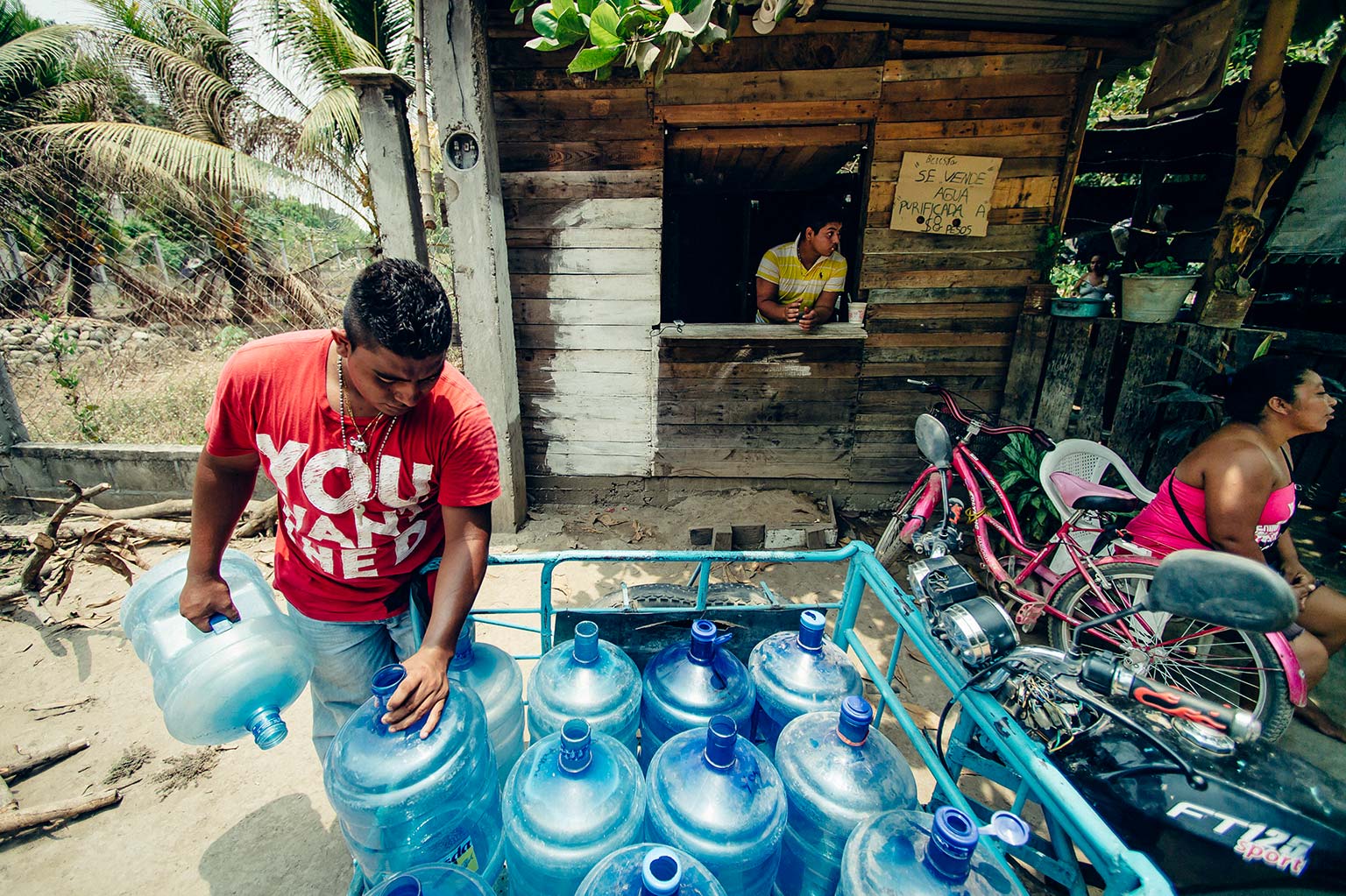 A man collects water to distribute to another community in Mexico.