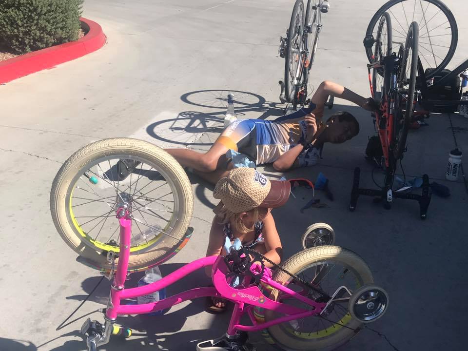 Scotty Parker fixes the bike tire.