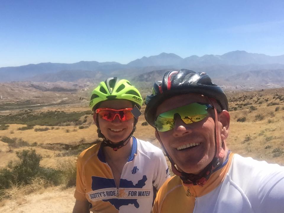 Scotty and a teammate take a selfie while biking through the mountains.